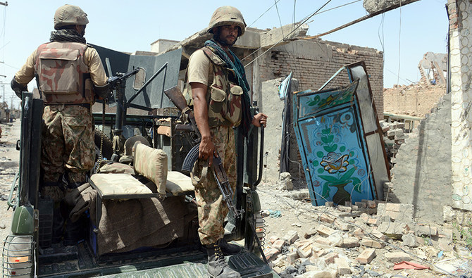 In this file photograph taken on July 9, 2014 shows Pakistani soldiers patrol during a military operation against Taliban militants, in the main town of Miranshah in North Waziristan. (AFP)