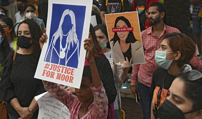 Women rights activists hold placards during a demonstration in Lahore on July 24, 2021, against the brutal killing of Noor Mukadam in Islamabad. (AFP/File)