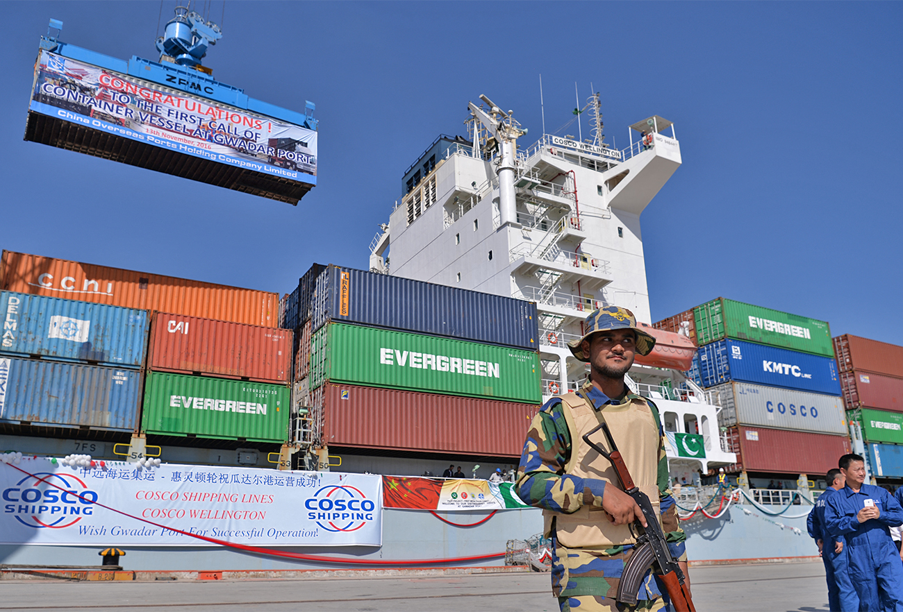 Pakistani Naval personnel stand guard near a ship carrying containers at the Gwadar port, Pakistan, on November 13, 2016. (AFP/File)