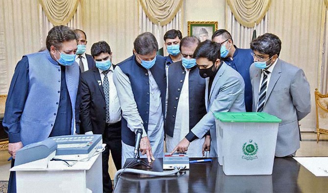 This undated file photo shows Pakistan Prime Minister Imran Khan at the demonstration of Electronic Voting Machine developed by Ministry of Science and Technology. (APP/File)