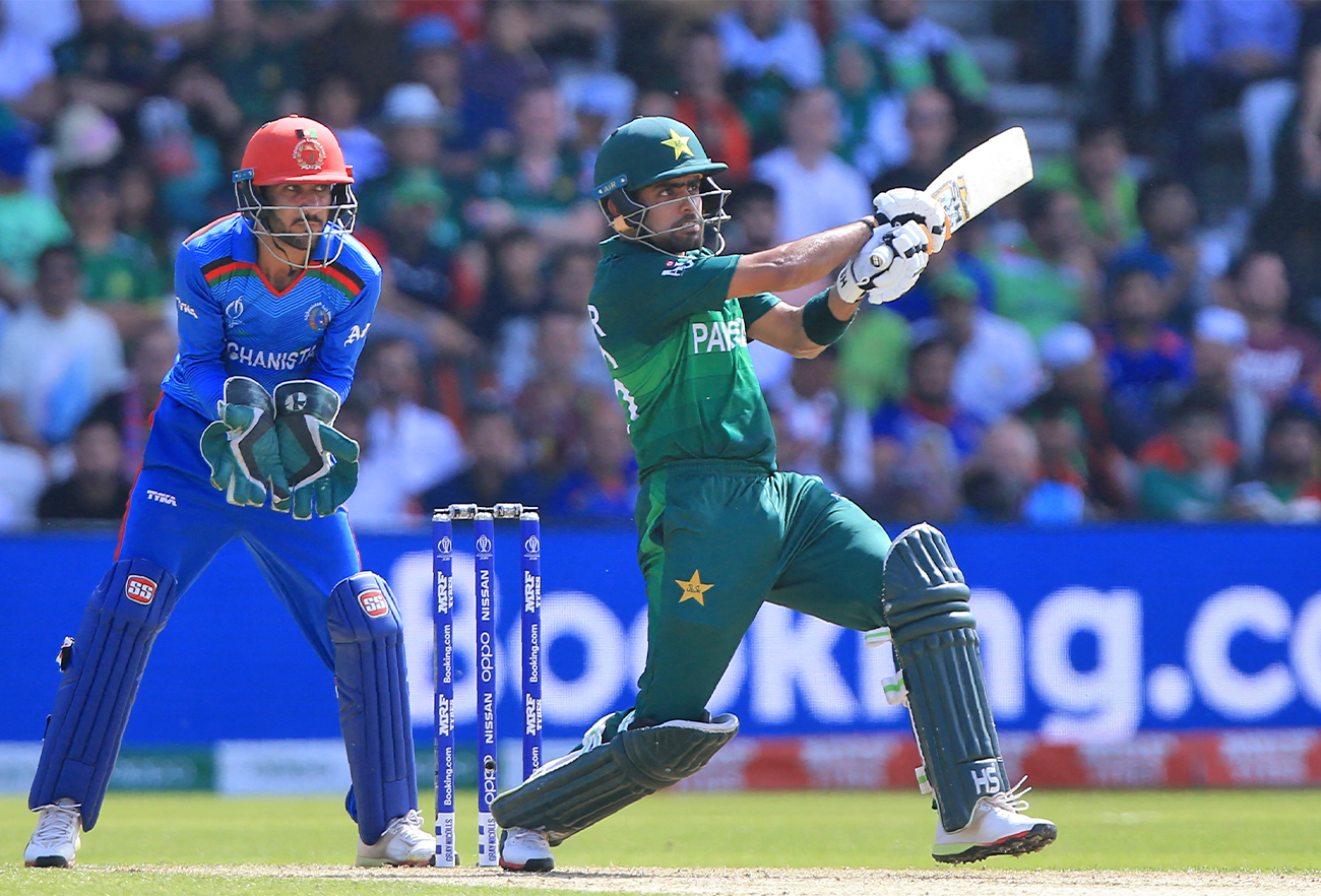 Pakistan's Babar Azam (R) plays a shot as Afghanistan's wicketkeeper Ikram Ali Khil looks on during the 2019 Cricket World Cup group stage match at Headingley in Leeds, England, on June 29, 2019. (AFP/File)