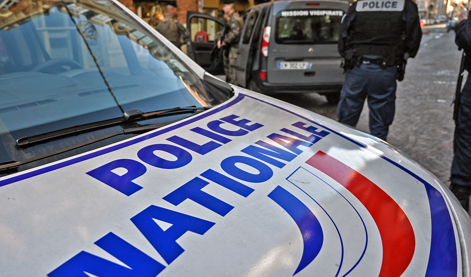 A French police officer stands next to a French "Police Nationale" car in Lille, northern France on December 3, 2019. (AFP/File)