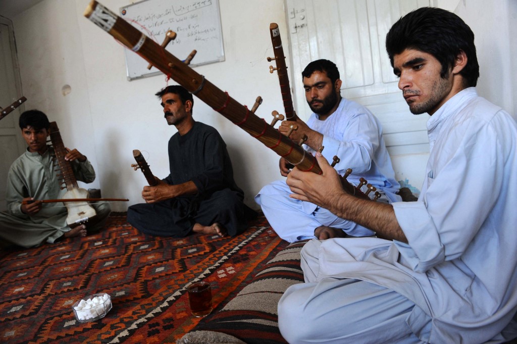 Afghan music students play the sitar in Herat on August 21, 2013. (AFP/File)