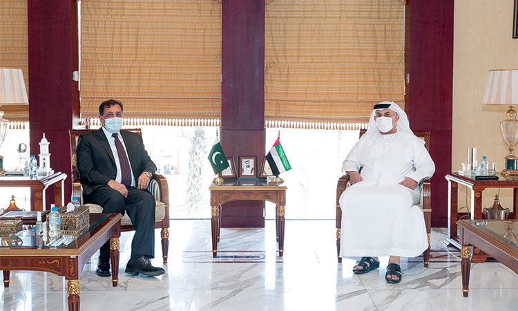 Mohamed Helal Al Mheiri, the Director-General of the Abu Dhabi Chamber of Commerce and Industry (R), met with Pakistani ambassador to the UAE Afzaal Mahmood (L) in Abu Dhabi on Sept. 27, 2021. ( Photo courtesy: WAM)
