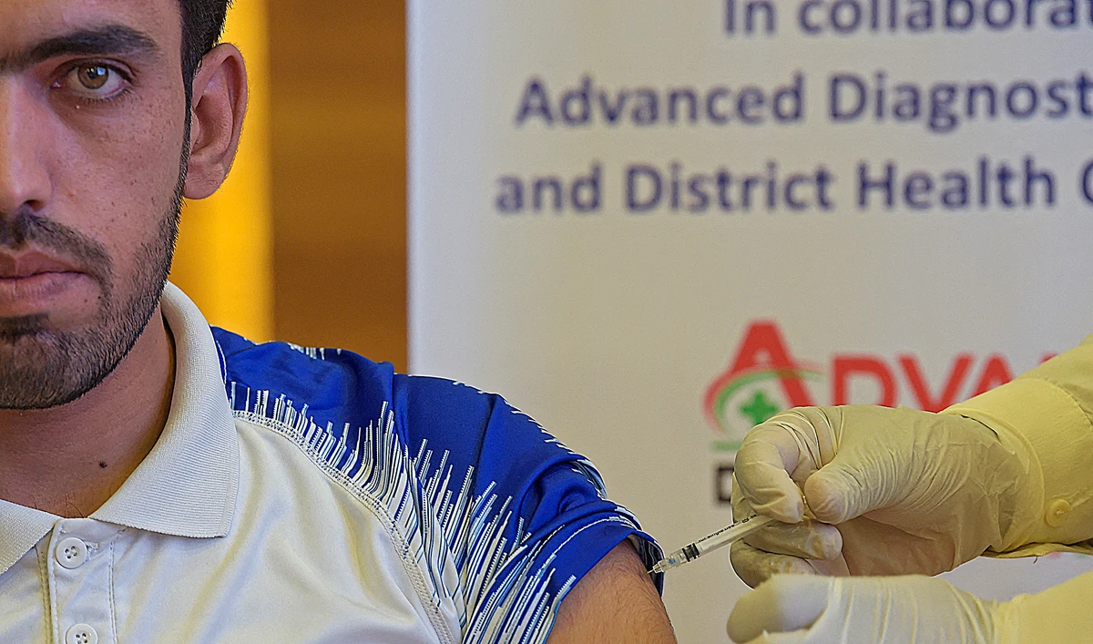 A student receives a dose of the CanSino Biologics' Covid-19 coronavirus vaccine at a university in Islamabad on June 28, 2021. (AFP/File)