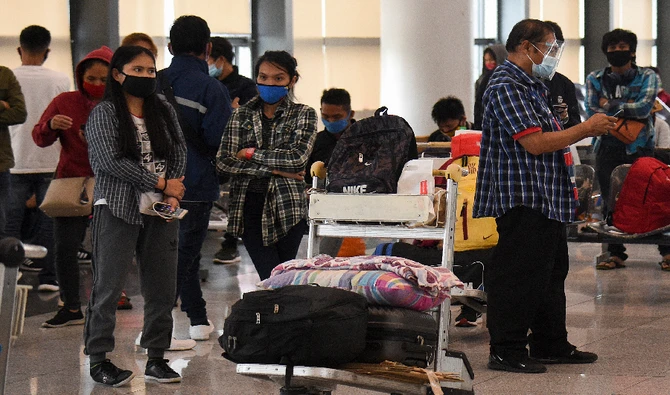 Stranded passengers wait for updates at the airport in Manila, Philippines on August 4, 2020. (AFP/ File)