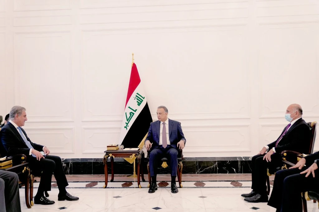 Pakistan's Foreign Minister Shah Mahmood Qureshi (L) meets Iraqi Prime Minister Mustafa Al-Kadhimi (C), in Islamabad, Pakistan on May 29, 2021. (Photo courtesy: FM Qureshi Twitter/File)
