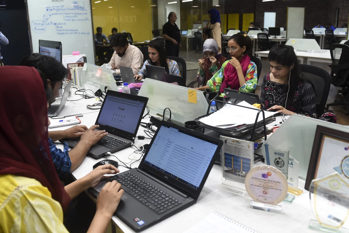 In this photograph taken on May 24, 2019, People work at their stations at the National Incubation Centre (NIC), a start-up incubator, in Lahore. (AFP/ File)