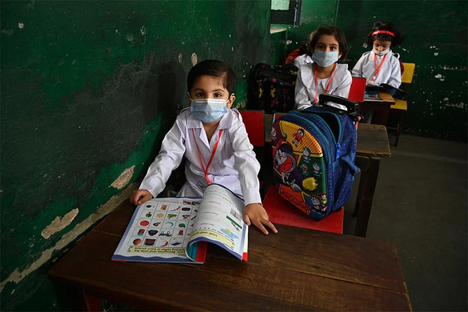 Students attend their class at a school in Rawalpindi, Pakistan, on June 7, 2021. (AFP)