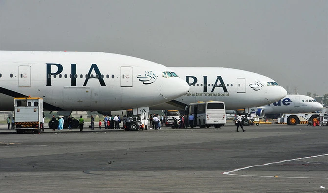 Pakistan International Airline (PIA) planes are positioned on the tarmac at the Benazir Bhutto International Airport in Islamabad on October 10, 2012. (AFP/ File)