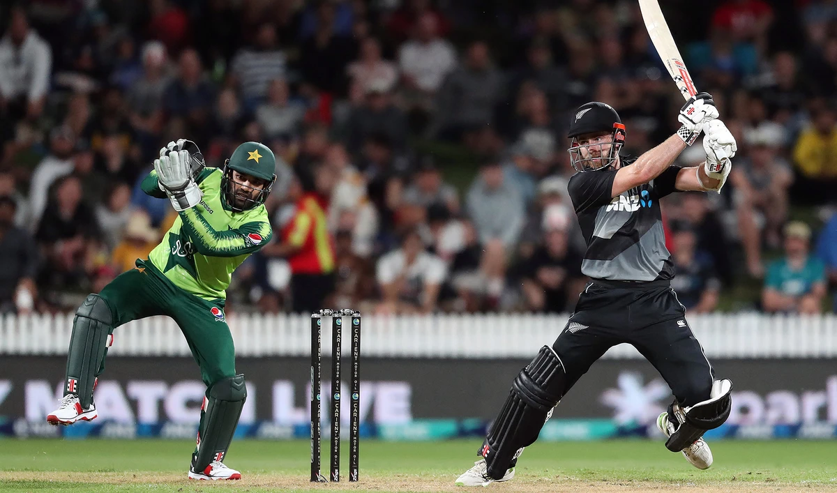 New Zealand’s Kane Williamson, right, plays a shot as Pakistan's wicketkeeper Mohammad Rizwan looks on during the second T20 international cricket match between New Zealand and Pakistan in Hamilton on December 20, 2020. (AFP/File)