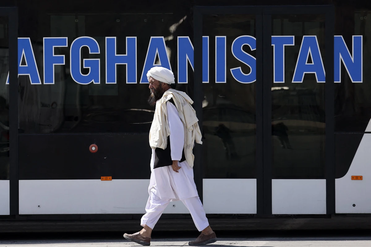 A member of the Taliban walks at the airport in Kabul on September 13, 2021. (AFP)