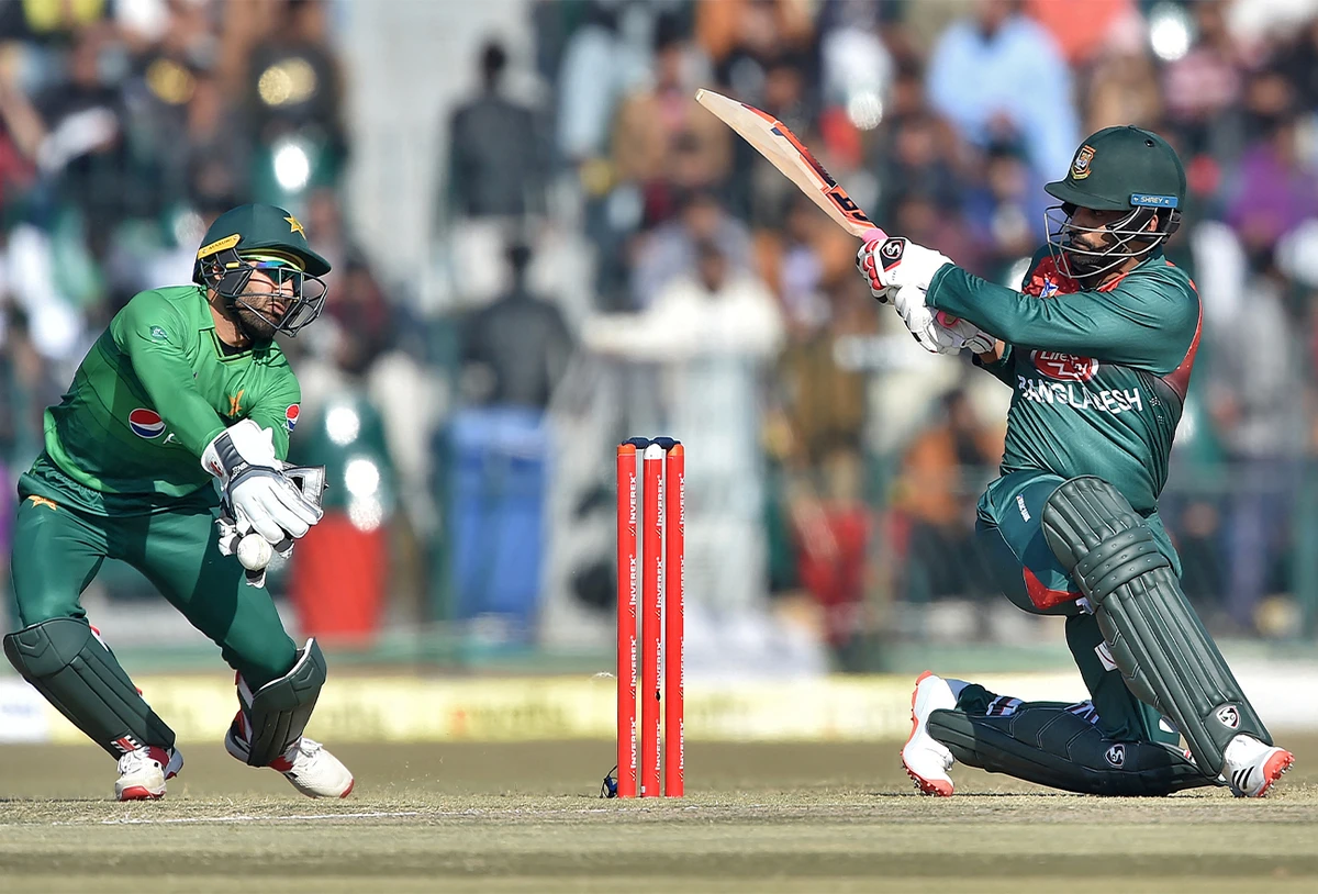 Bangladesh's Tamim Iqbal (R) plays a shot during the first T20 international cricket match of a three-match series between Pakistan and Bangladesh at Gaddafi Cricket Stadium in Lahore, Pakistan, on January 24, 2020. (AFP/File)