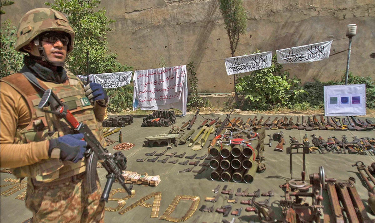 A soldier stands by ammunition seized during a military operation against Taliban militants, in the of town of Miramshah, North Waziristan, on July 9, 2014. (REUTERS/File)