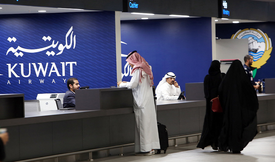 A picture taken on September 30, 2018, shows travellers checking-in at the new Terminal 4 of Kuwait International Airport, south of Kuwait City. (AFP/FILE)