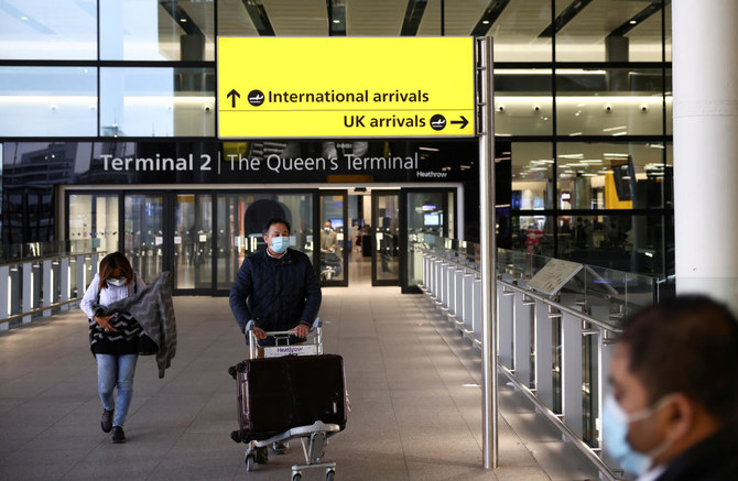 Travellers walk through Terminal 2 at Heathrow Airport, amid the coronavirus disease (COVID-19) outbreak in London, Britain February 14, 2021. (REUTERS)