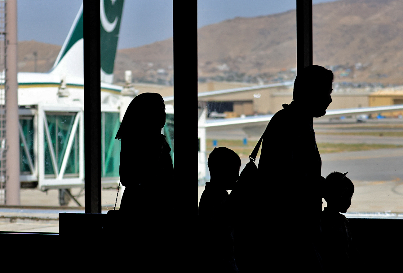 Passengers leave to board on a Pakistan International Airlines plane at the airport in Kabul, Afghanistan, on September 13, 2021. (AFP/File)