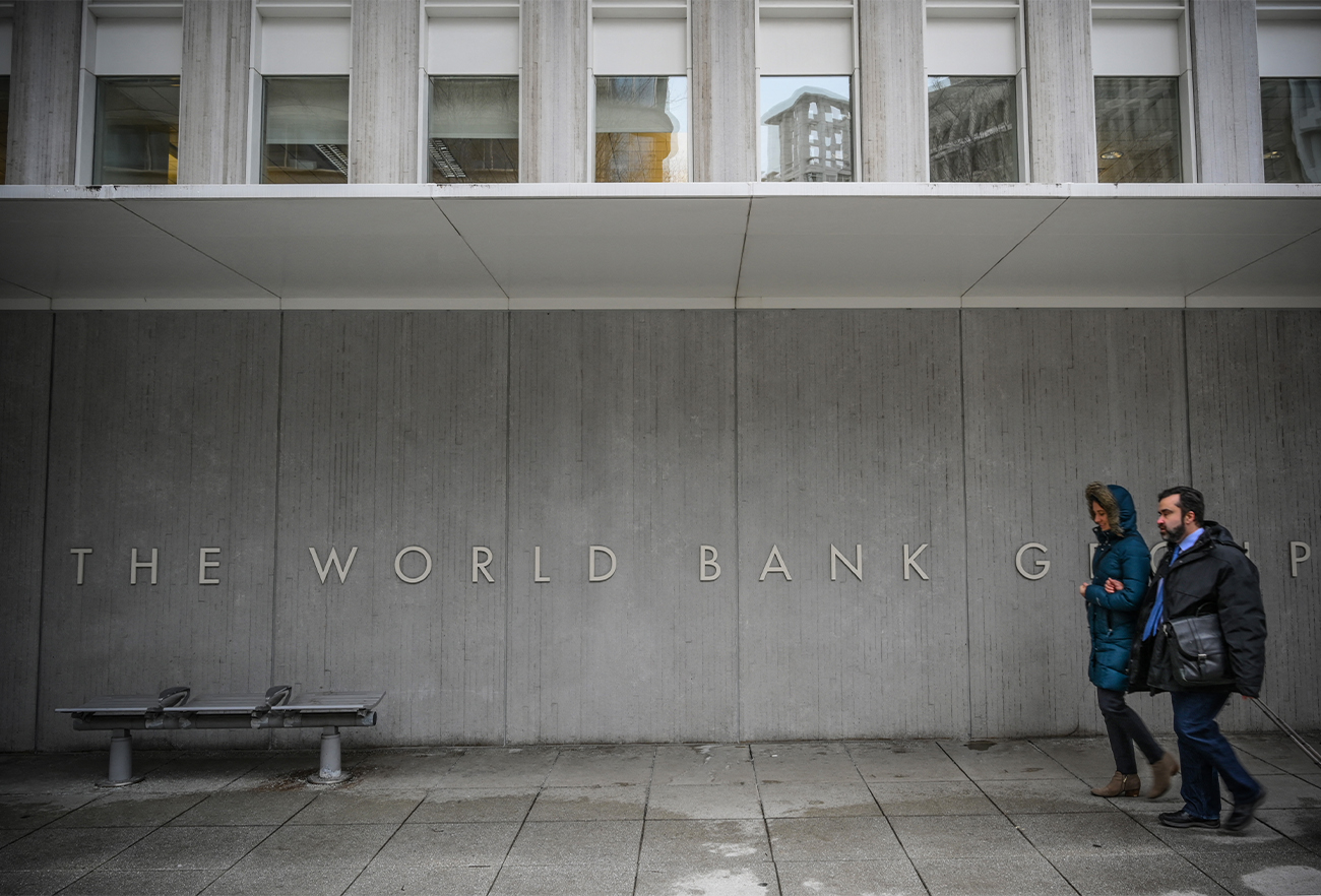 People walk by the building of the Washington-based global development lender, The World Bank Group, in Washington, US, on January 17, 2019. (AFP/File)