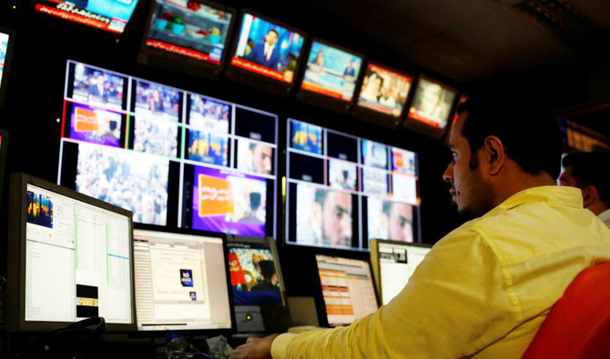 An employee works at the control room of the Geo News television channel in Karachi, Pakistan, in this April 11, 2018. (REUTERS)