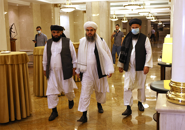 Leaders of the Taliban movement and negotiators Abdul Latif Mansoor (R), Shahabuddin Delawar (C) and Suhail Shaheen (L) walk to attend a press conference in Moscow on July 9, 2021. (AFP)
