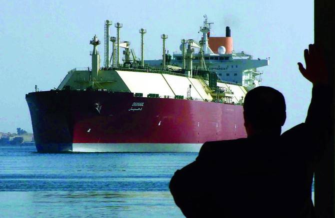 An Egyptian man looks at the Qatari Liquefied Natural Gas (LNG) carrier "Duhail" as its passes through the Suez Canal near the Egyptian port city of Ismailia on April 1, 2008. (REUTERS)