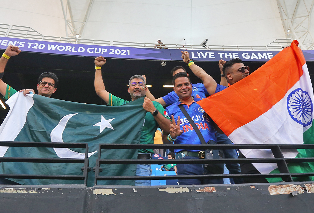 India and Pakistan fans display their flags in the stand before the match between India and Pakistan in Dubai, UAE, on October 24, 2021. (REUTERS)