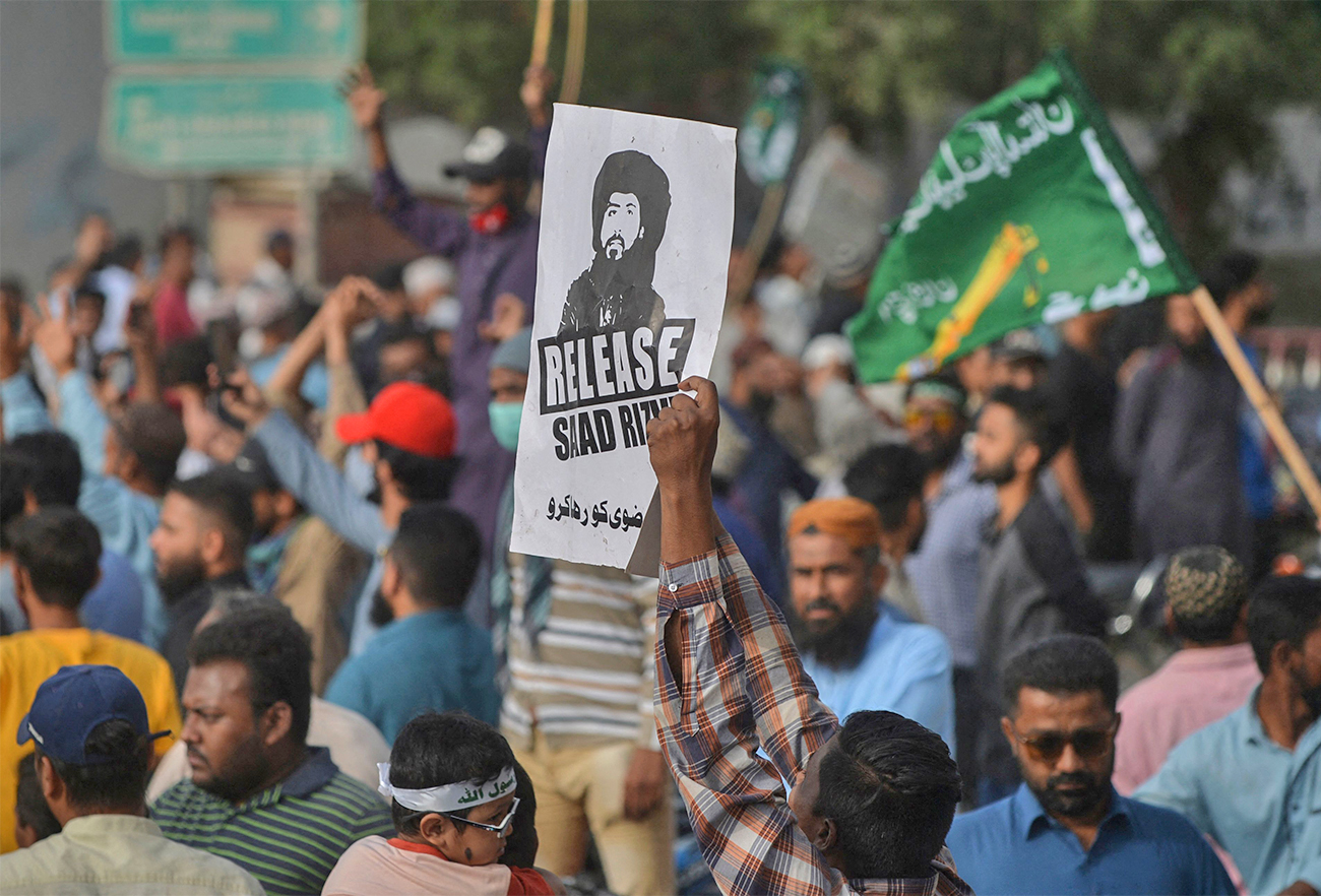 Supporters of Tehreek-e-Labbaik Pakistan (TLP) party take part in a protest in Karachi on October 24, 2021, demanding the release of their leader Hafiz Saad Hussain Rizvi, son of late Khadim Hussain Rizvi. (AFP)