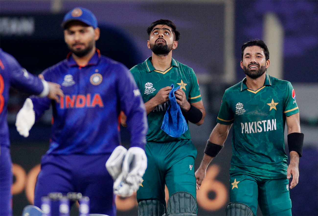 Pakistan's Mohammad Rizwan (R) and Babar Azam (2R) celebrate after winning the match against India in Dubai, UAE, on October 24, 2021. (REUTERS)
