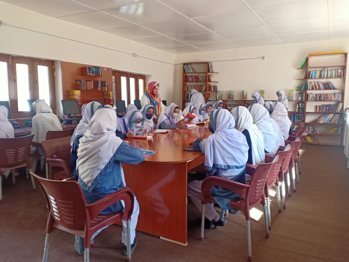 Students read books at a newly-established library at the Gorikot Girls Higher Secondary School in Astore district of Gilgit-Baltistan, Pakistan, on October 16, 2021. (Photo courtesy: Halima Wazir)
