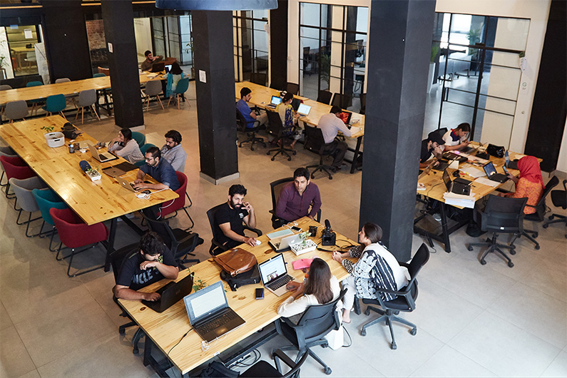 People can be seen working at a coworking space built by Colabs in Lahore, Pakistan, in this photo shared by the Pakistani startup on October 25, 2021. (Photo courtesy: Colabs)