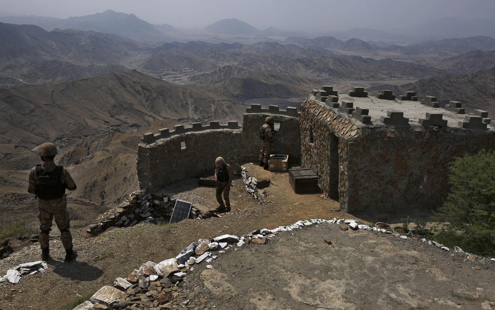 In this Aug. 3, 2021 file photo, Pakistan Army troops observe the area from hilltop post on the Pakistan Afghanistan, in Khyber district, Pakistan. (AP)