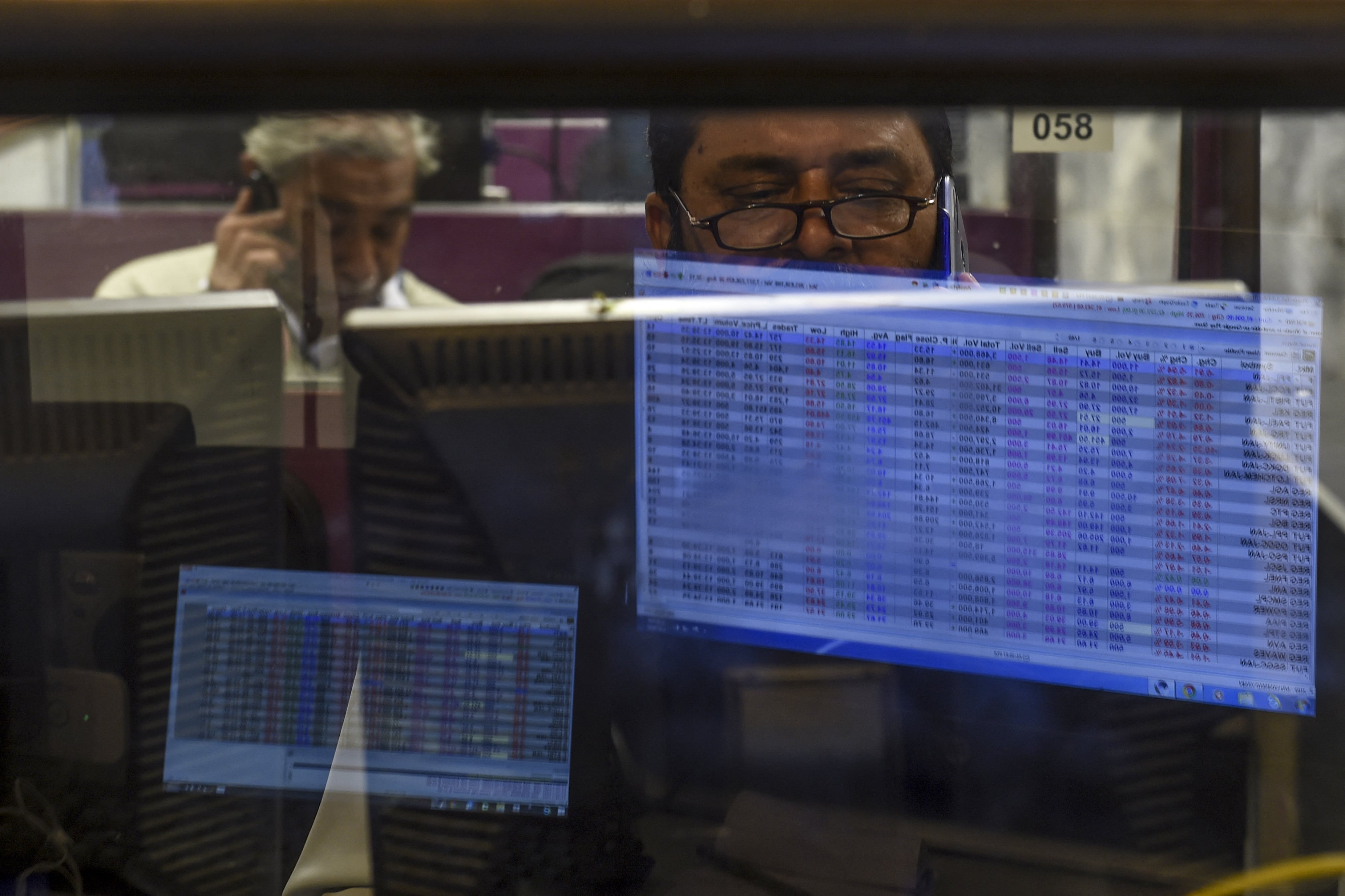 A stockbroker monitors latest share prices during a trading session at the Pakistan Stock Exchange (PSX) in Karachi on January 6, 2020. (AFP)