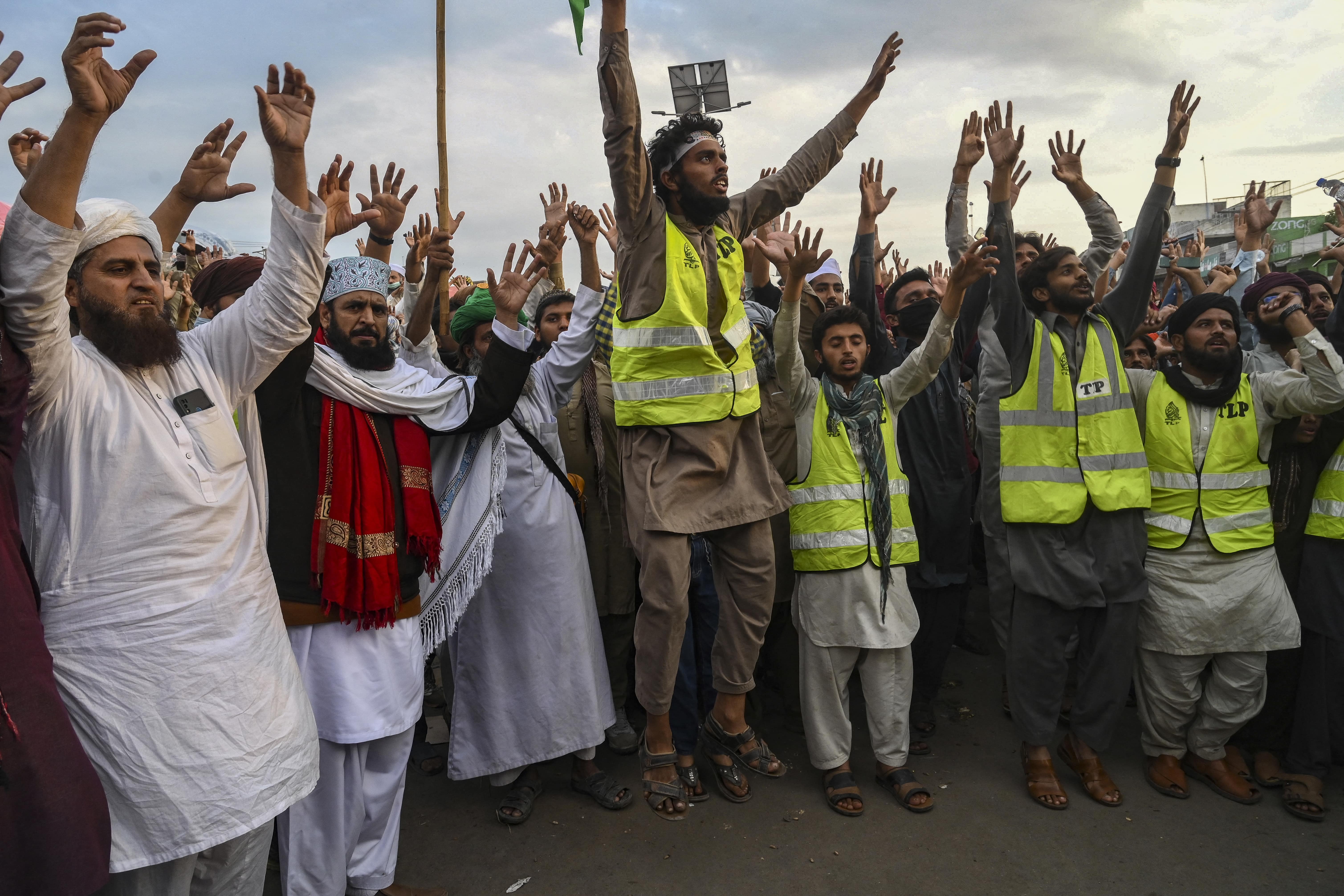 Supporters of Tehreek-e-Labbaik Pakistan (TLP) party gather in a protest march in Muridke, on October 24, 2021. (AFP)