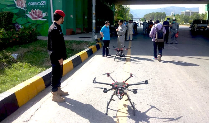 In this photo, Islamabad traffic police stand near drones ready to monitor traffic in Islamabad, Pakistan on June 14, 2021. (Photo courtesy: Islamabad Traffic Police)