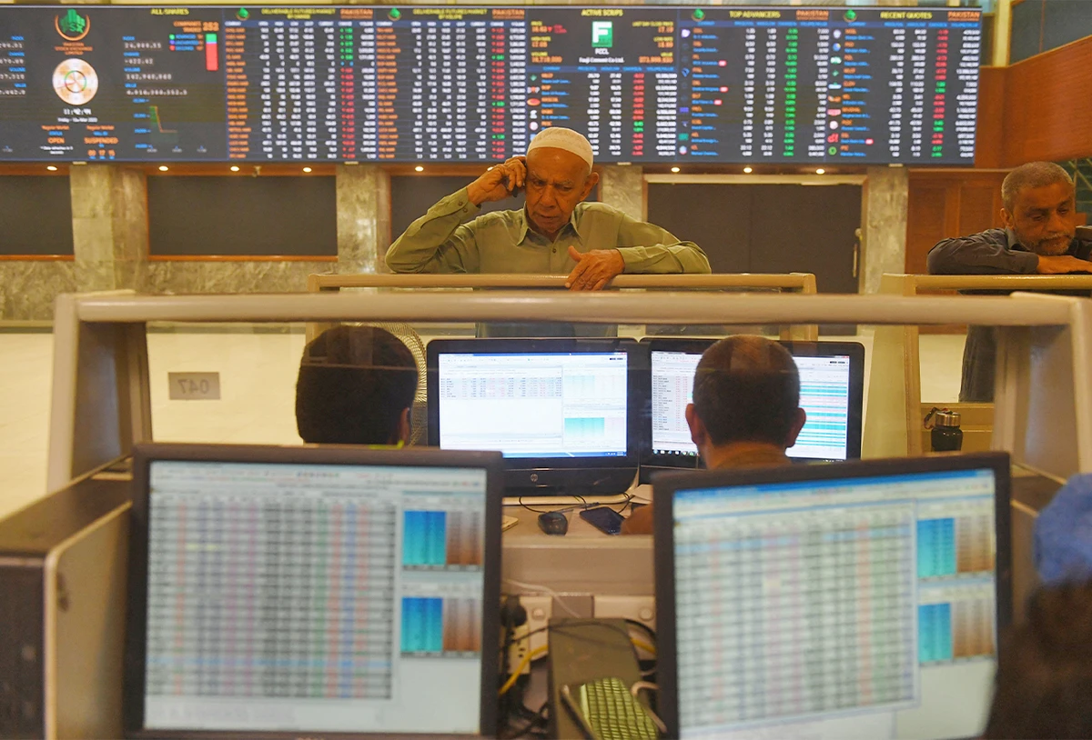 Stockbrokers monitor share prices at the Pakistan Stock Exchange (PSX) in Karachi, Pakistan, on March 13, 2020. (AFP/File)