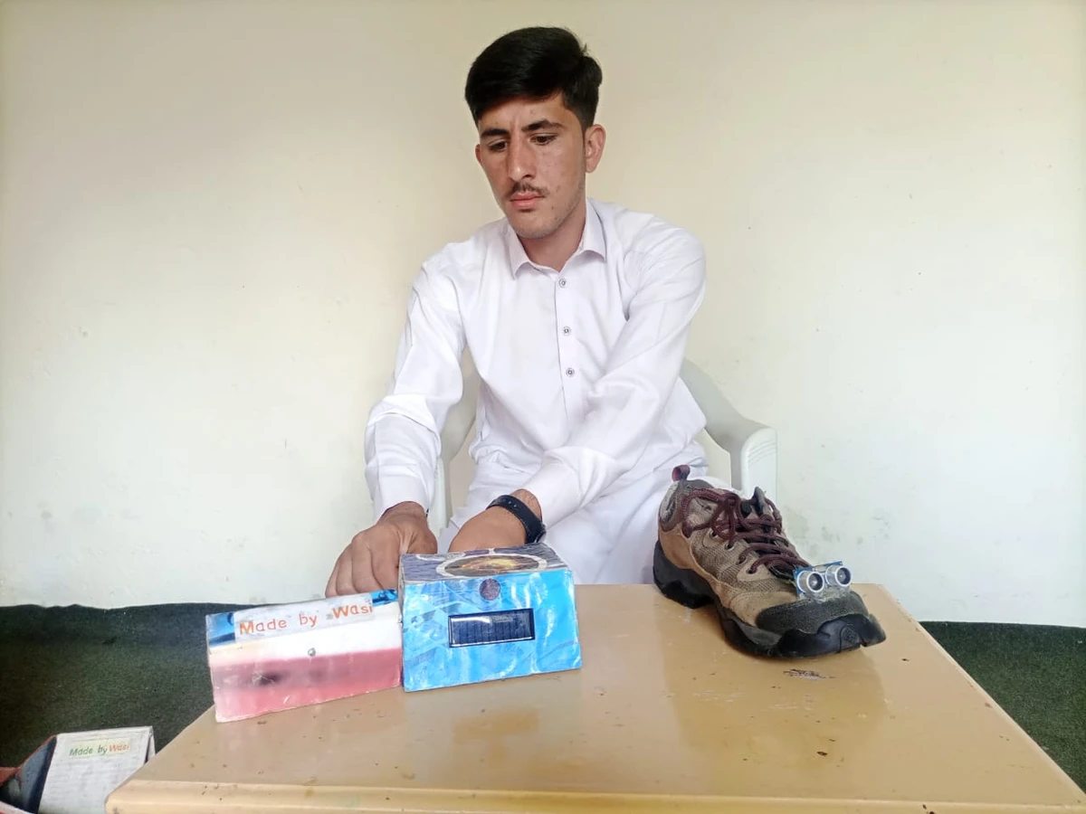 Wasiullah, the inventor of "smart shoes" for the blind poses at his home in Swat, northwestern Pakistan on October 13, 2021. (Photo courtesy: Wasiullah)