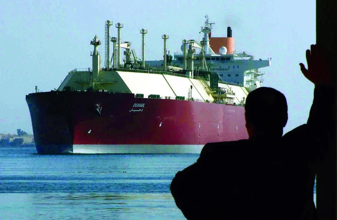 An Egyptian man looks at the Qatari Liquefied Natural Gas (LNG) carrier "Duhail" as its passes through the Suez Canal near the Egyptian port city of Ismailia on April 1, 2008. (REUTERS)