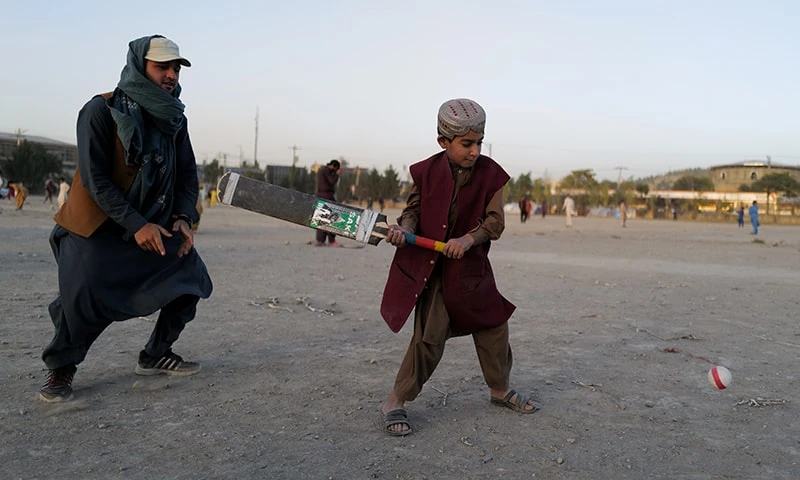 Khobiab, seven, from Kandahar province is learning how to play cricket at a playground in Kabul, Afghanistan, on October 22, 2021. (REUTERS)