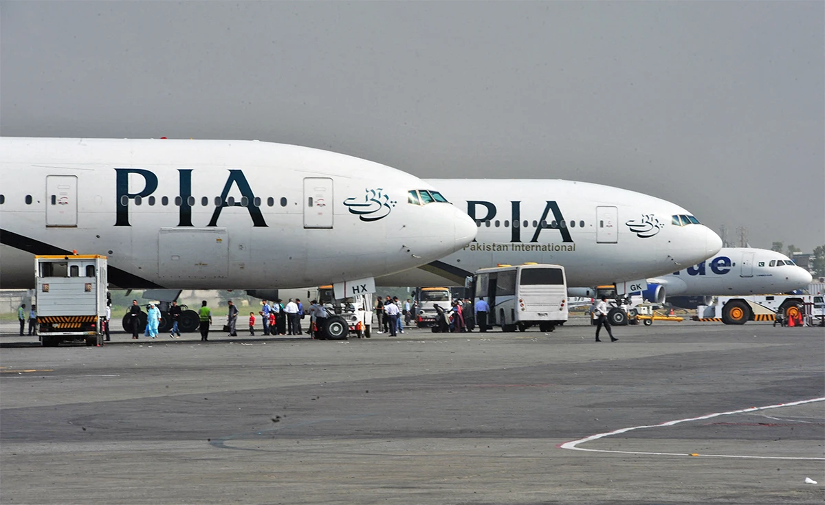 Pakistan International Airline (PIA) planes are positioned on the tarmac at the Benazir Bhutto International Airport in Islamabad, Pakistan, on October 10, 2012. (AFP/File)