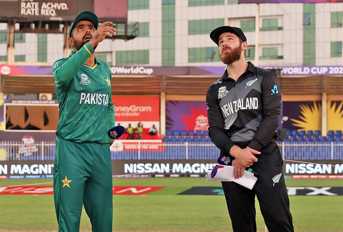 Pakistan's captain Babar Azam (R) tosses the coin as his New Zealand's counterpart Kane Williamson stares at the coin before the start of T20 World Cup match Pakistan and New Zealand in Sharjah on October 25, 2021. (Photo courtesy: PCB)