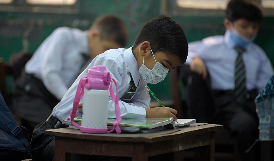 Students attend their class at a school in Rawalpindi on June 7, 2021. (AFP)