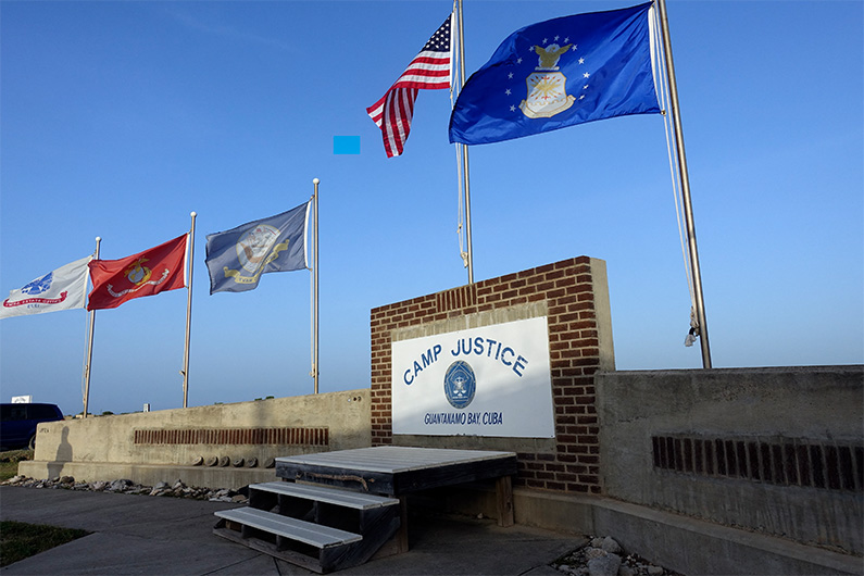 This photo screened by US Military officials on September 7, 2021 shows a sign for Camp Justice in Guantanamo Bay Naval Base, Cuba. (AFP)