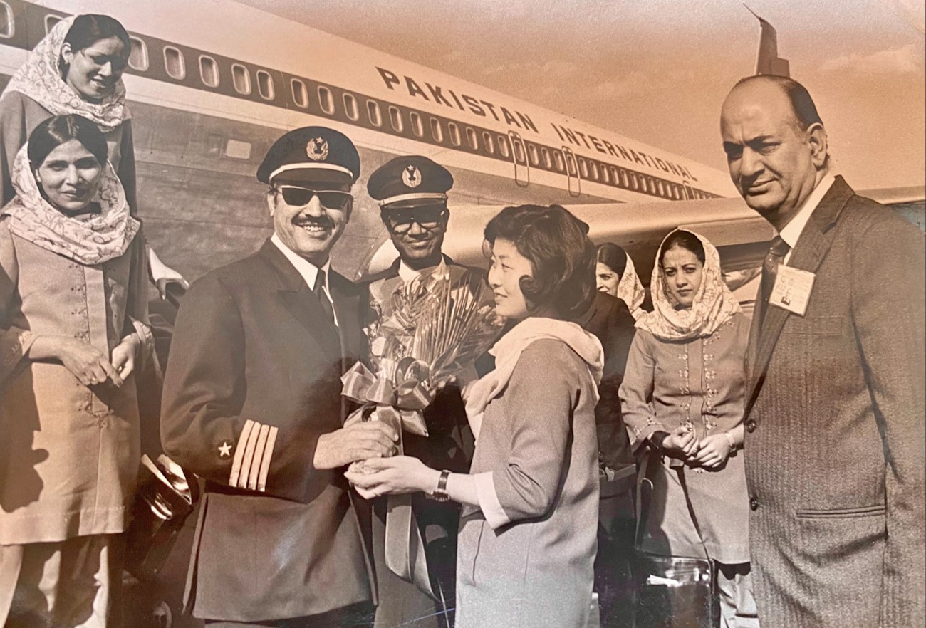 In this undated photo, Capt. Fazal Ghani Mian is receiving a flower bouquet at Beijing airport, China. (Courtesy: Capt. Fazal Ghani Mian family)