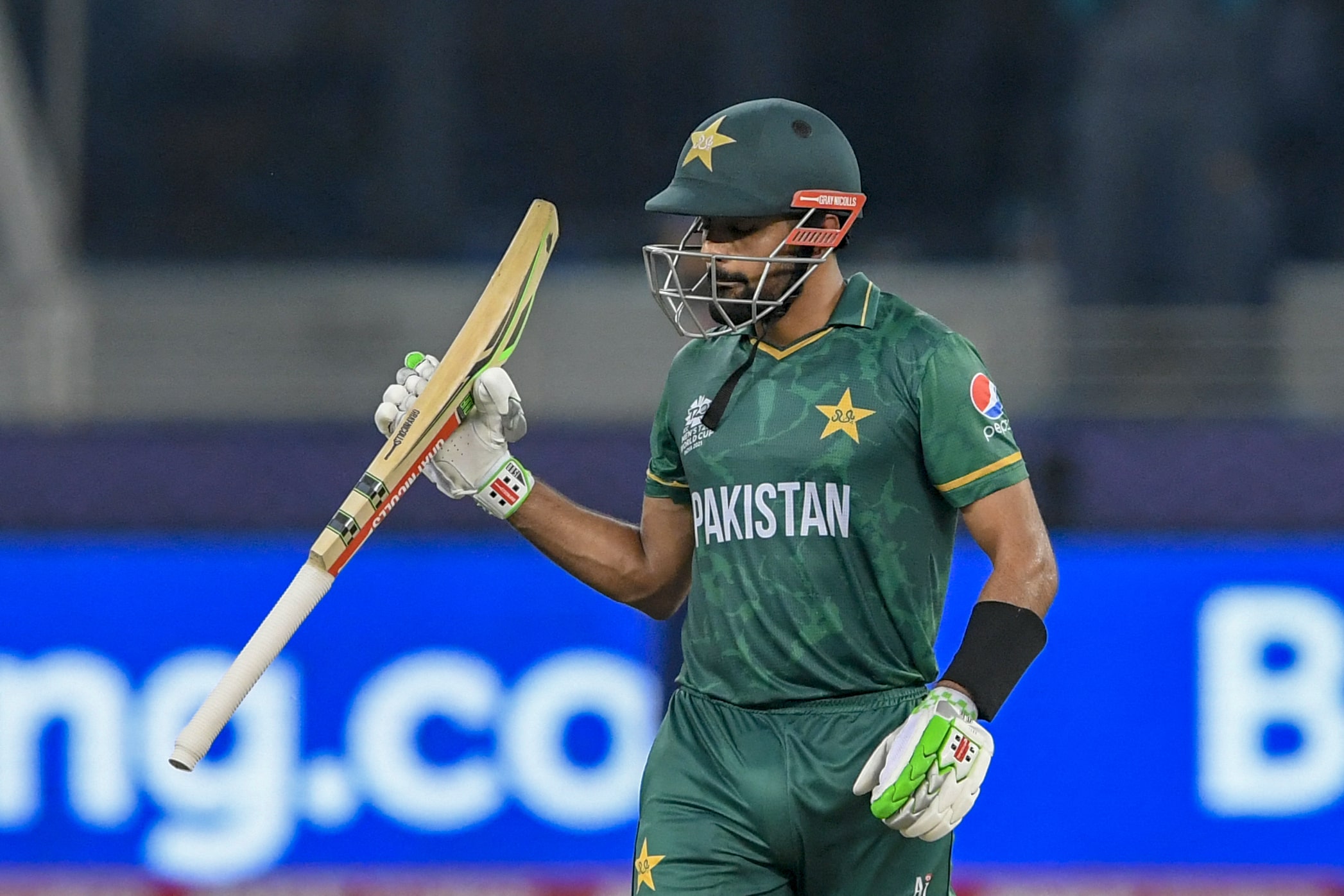 Pakistan's captain Babar Azam celebrates after scoring a half-century (50 runs) during the ICC men’s Twenty20 World Cup cricket match between India and Pakistan at the Dubai International Cricket Stadium in Dubai on October 24, 2021. (AFP)