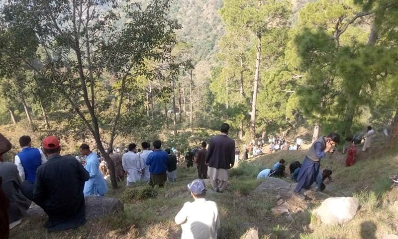 People gather at the site of the accident in Azad Kashmir on November 3, 2021. (Photo courtesy: Social Media)