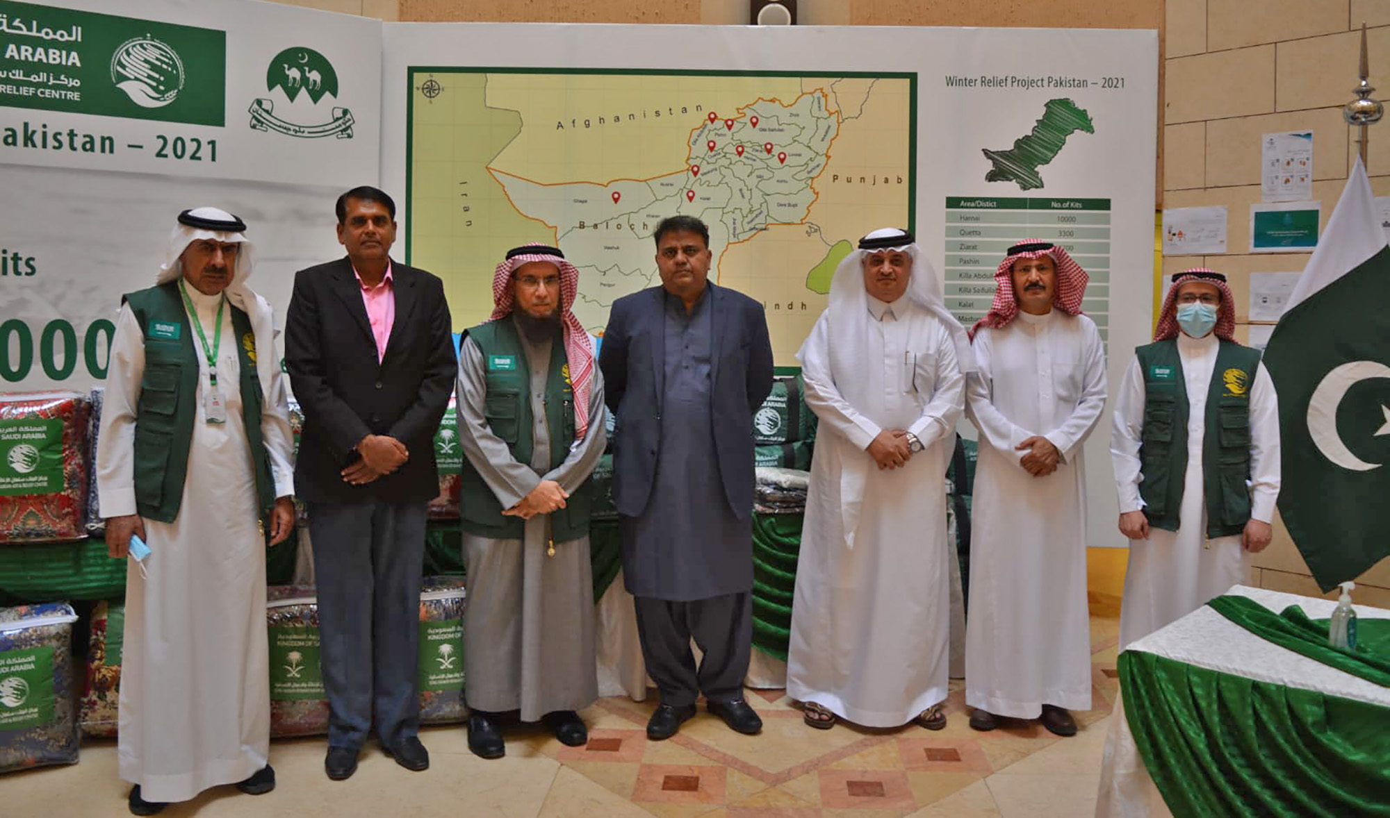Pakistan's information minister Chaudhry Fawad Hussain and Saudi envoy to Pakistan Nawaf bin Said Al-Malki attend the inauguration ceremony of KSRelief’s winter aid project in Islamabad, Pakistan, on November 4, 2021. (Photo by: @KSAembassyPK/Twitter)