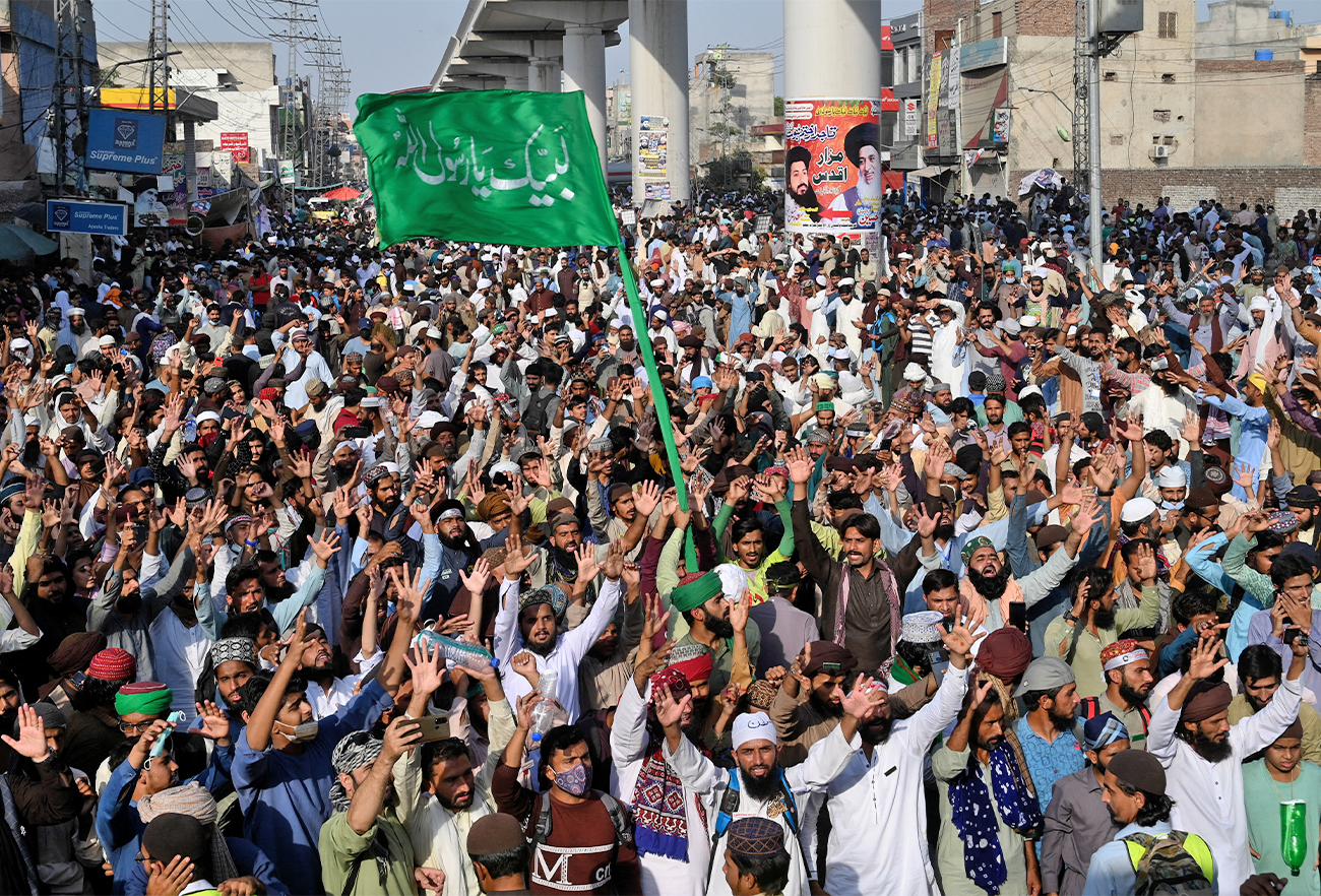 Supporters of Tehreek-e-Labbaik Pakistan (TLP) party shout slogans as they march towards capital Islamabad from Lahore, Pakistan, on October 22, 2021. (AFP)