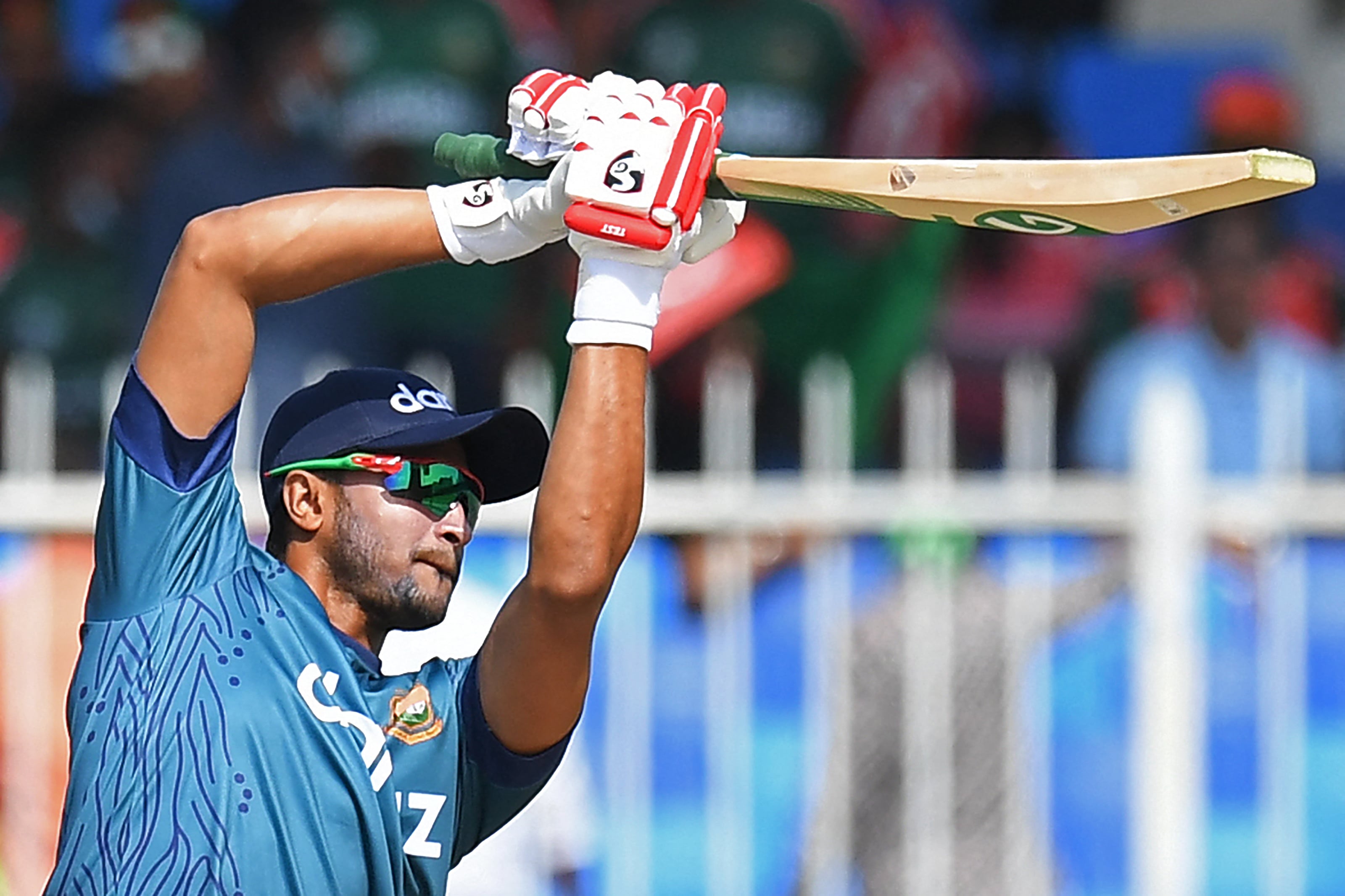 Bangladesh's Shakib Al Hasan warms up before the start of the ICC men’s Twenty20 World Cup cricket match between Bangladesh and West Indies at the Sharjah Cricket Stadium in Sharjah on October 29, 2021. (AFP)