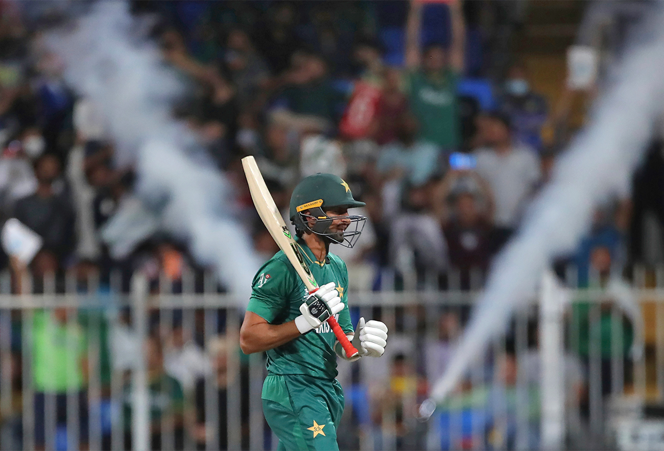 Pakistan's Shoaib Malik reacts after hitting a boundary during the Cricket Twenty20 World Cup match between Pakistan and Scotland in Sharjah, UAE, on November 7, 2021. (AP)