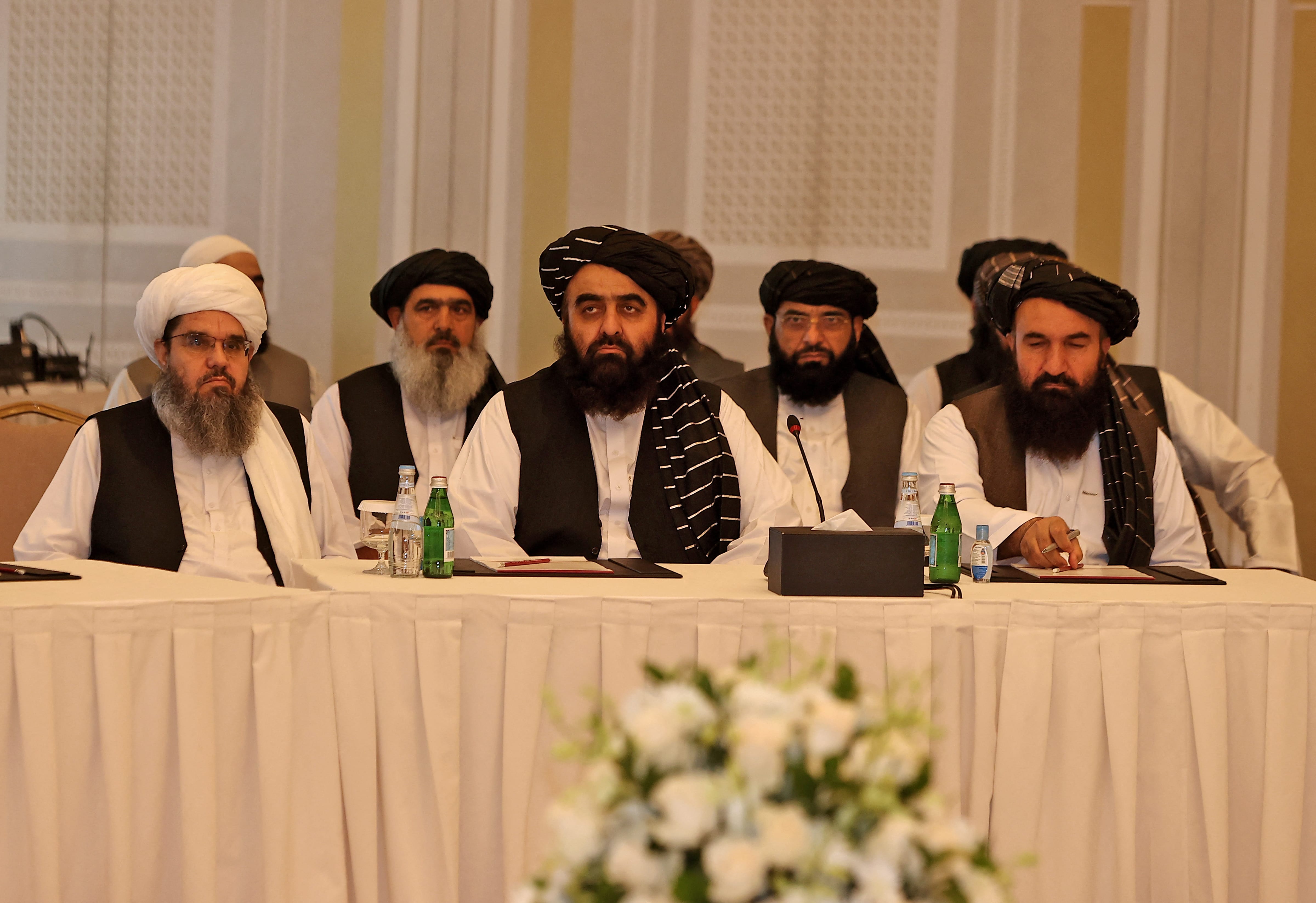 Members of the Taliban delegation Shahabuddin Delawar (L), Amir Khan Muttaqi, and Khairullah Khairkhwa (R) meet with foreign diplomats in Qatar's capital Doha, on October 12, 2021. (AFP)